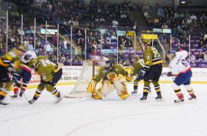 The Barrie Colts and the Brampton Battalion in an ice hockey game.